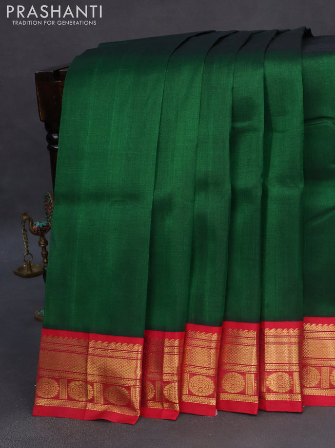 Silk cotton saree green and pink with plain body and zari woven korvai border