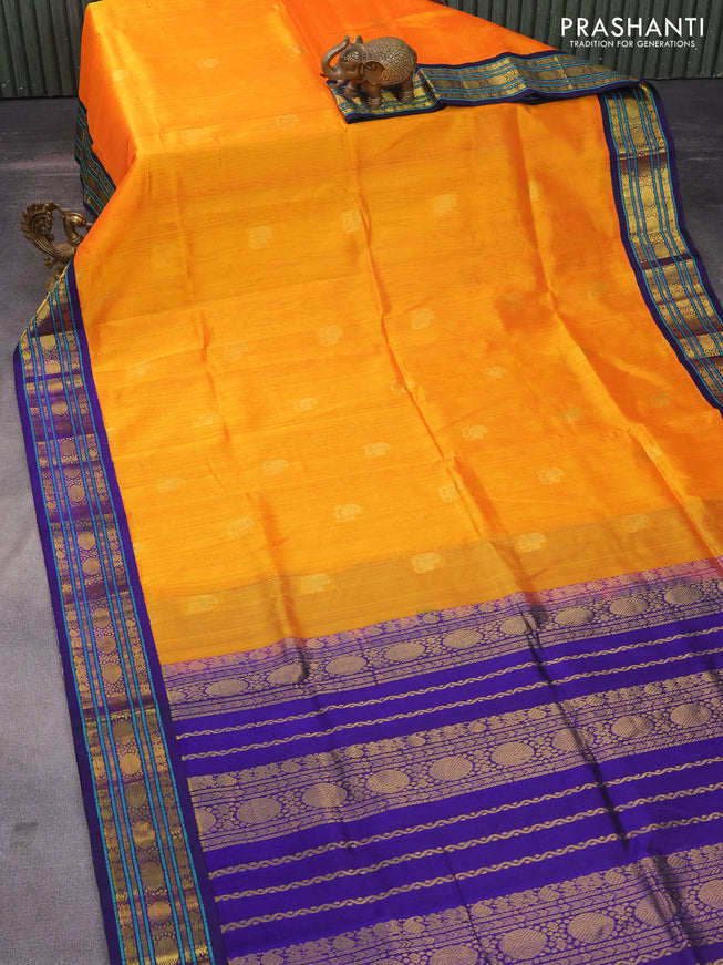 Silk cotton saree orange and blue with zari woven paisley buttas and zari woven korvai border