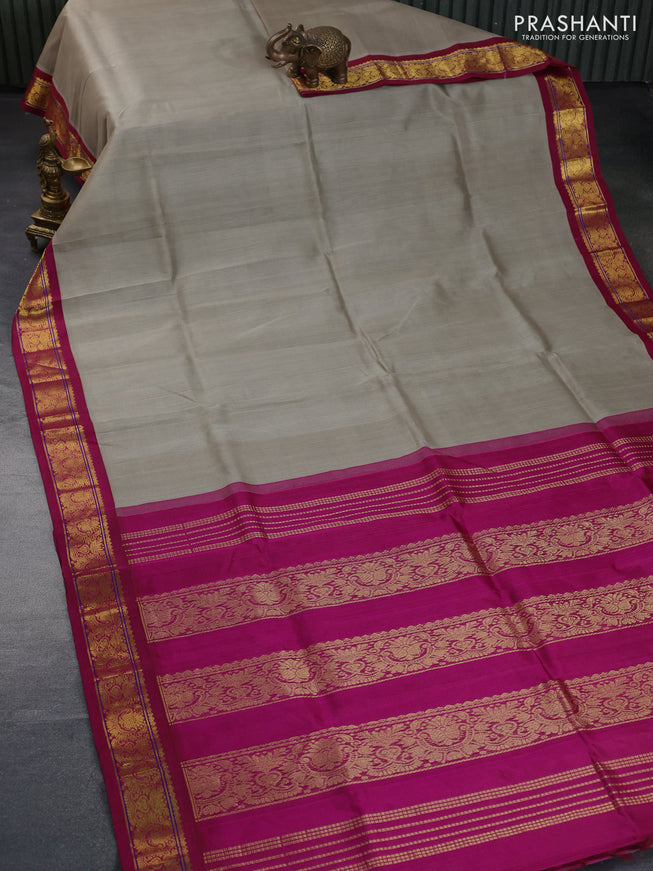 Silk cotton saree grey and magenta pink with plain body and zari woven korvai border