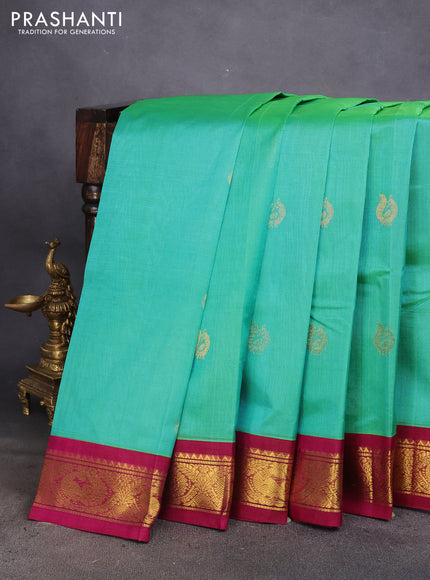 Silk cotton saree dual shade of teal green and magenta pink with zari woven annam buttas and zari woven korvai border