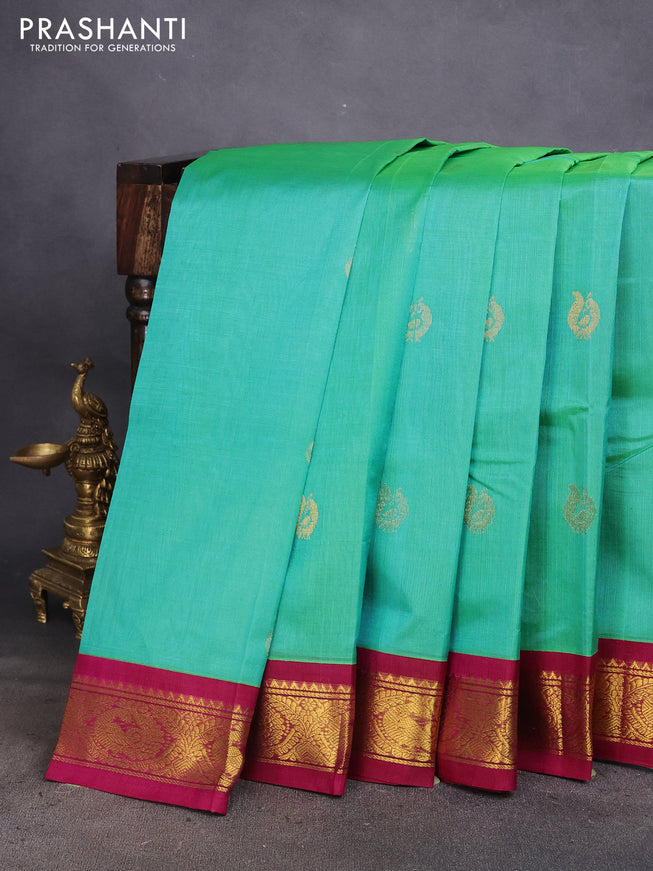 Silk cotton saree dual shade of teal green and magenta pink with zari woven annam buttas and zari woven korvai border