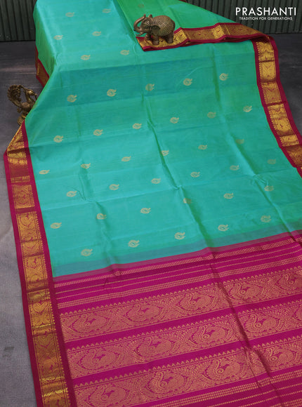 Silk cotton saree dual shade of teal green and magenta pink with zari woven annam buttas and zari woven korvai border