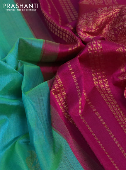 Silk cotton saree dual shade of teal green and magenta pink with zari woven annam buttas and zari woven korvai border