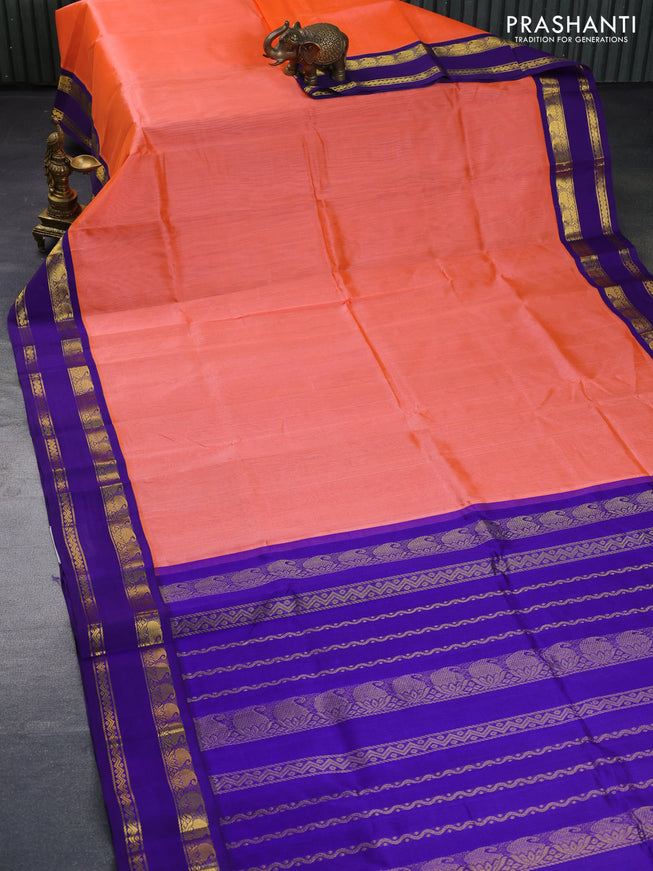 Silk cotton saree peach shade and blue with plain body and rettapet zari woven korvai border