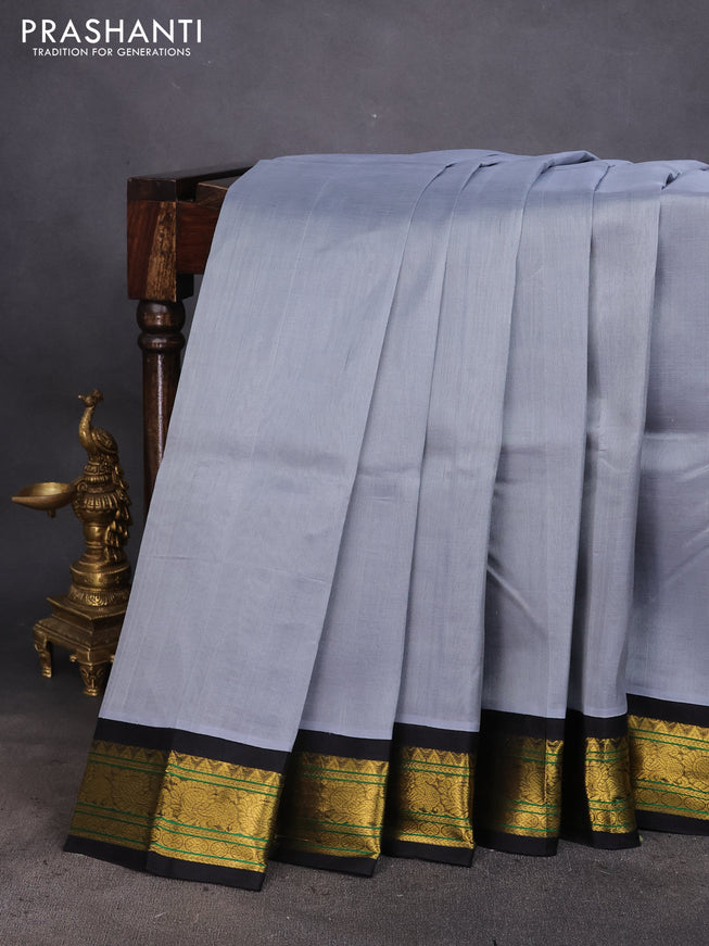 Silk cotton saree grey and black with plain body and zari woven korvai border