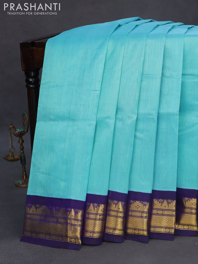 Silk cotton saree light blue and navy blue with plain body and zari woven korvai border