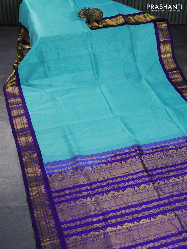 Silk cotton saree light blue and navy blue with plain body and zari woven korvai border