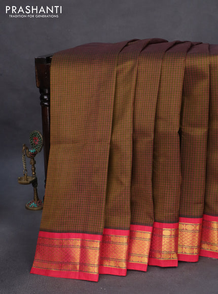 Silk cotton saree dark mehendi green and pink with allover thread checked pattern and zari woven korvai border