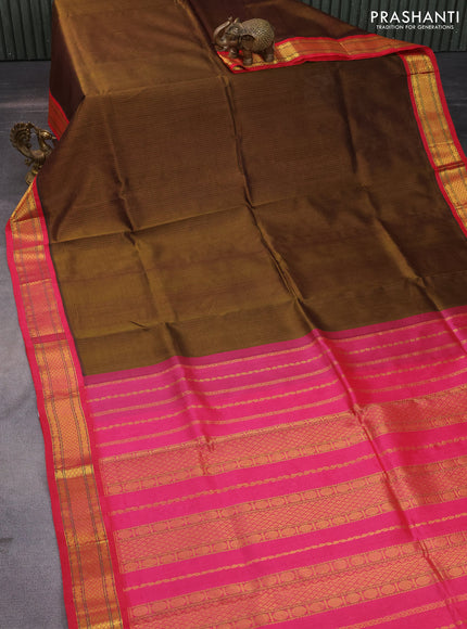 Silk cotton saree dark mehendi green and pink with allover thread checked pattern and zari woven korvai border