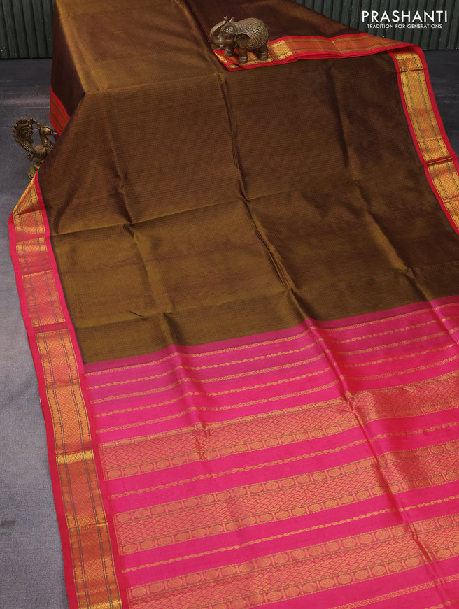 Silk cotton saree dark mehendi green and pink with allover thread checked pattern and zari woven korvai border