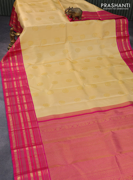 Pure kanchipuram silk saree sandal and pink with allover zari weaves & buttas and long zari woven border