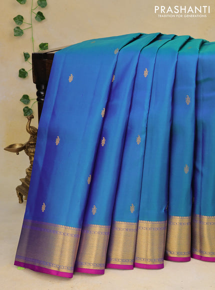 Pure kanchipuram silk saree dual shade of bluish green and purple with zari woven buttas and zari woven border