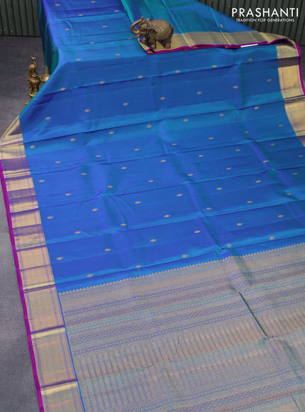 Pure kanchipuram silk saree dual shade of bluish green and purple with zari woven buttas and zari woven border