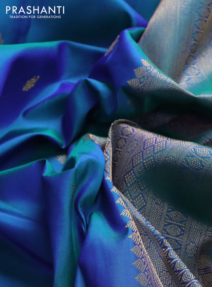 Pure kanchipuram silk saree dual shade of bluish green and purple with zari woven buttas and zari woven border