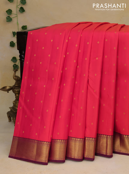 Pure kanchipuram silk saree dual shade of pinkish orange and purple with zari woven buttas and zari woven border