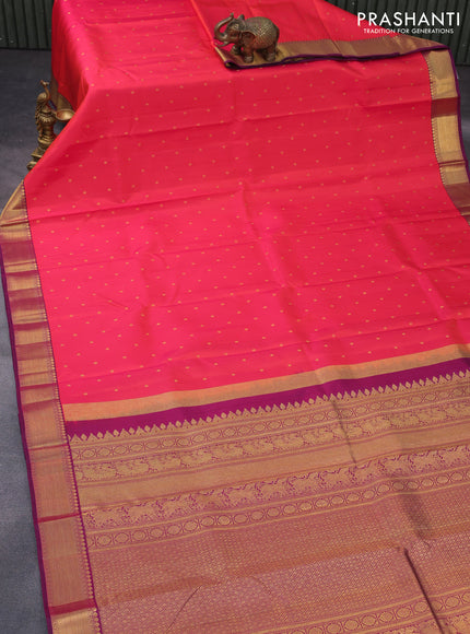 Pure kanchipuram silk saree dual shade of pinkish orange and purple with zari woven buttas and zari woven border