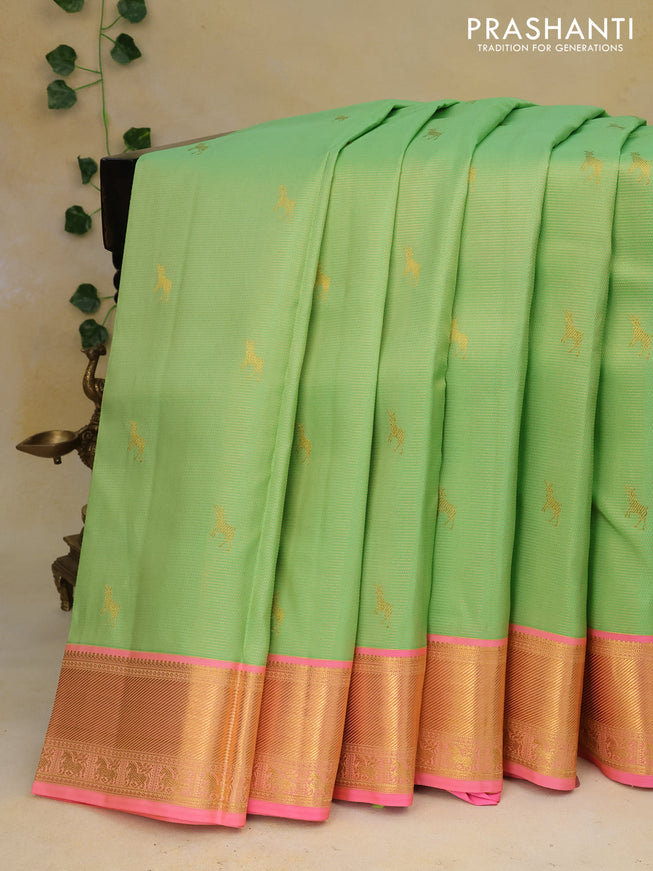 Pure kanchipuram silk saree light green and candy pink with allover zari weaves & buttas and zari woven border