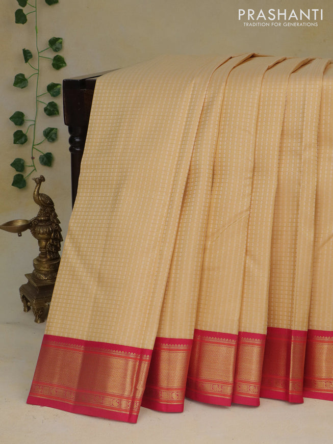 Pure kanchipuram silk saree sandal and pink with allover zari checks & self emboss and zari woven border