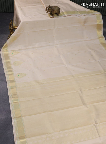 Pure kanchipuram silk saree cream with zari woven buttas and zari woven border