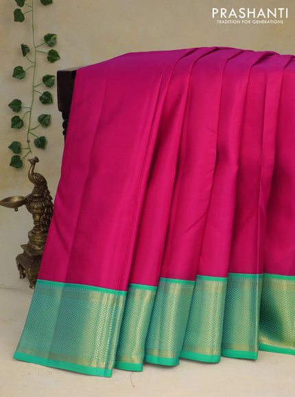 Pure kanchipuram silk saree pink and teal green with plain body and zari woven border