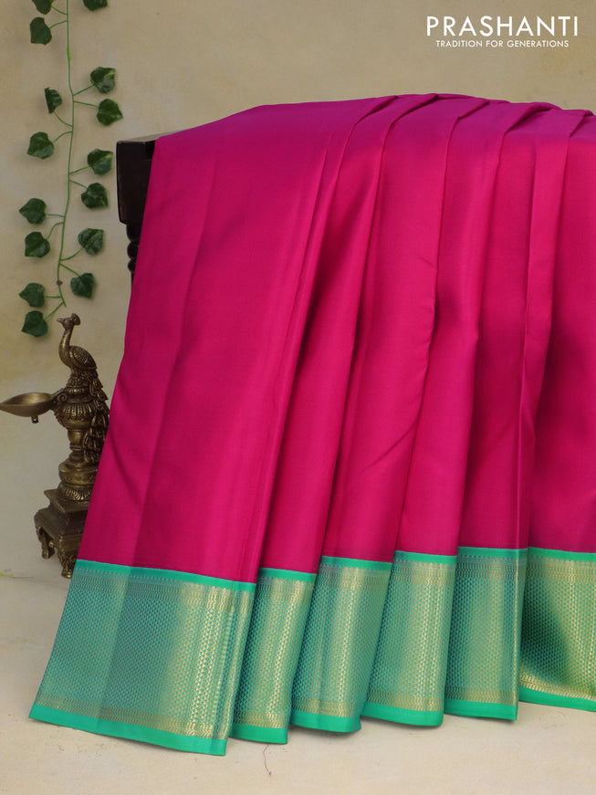 Pure kanchipuram silk saree pink and teal green with plain body and zari woven border