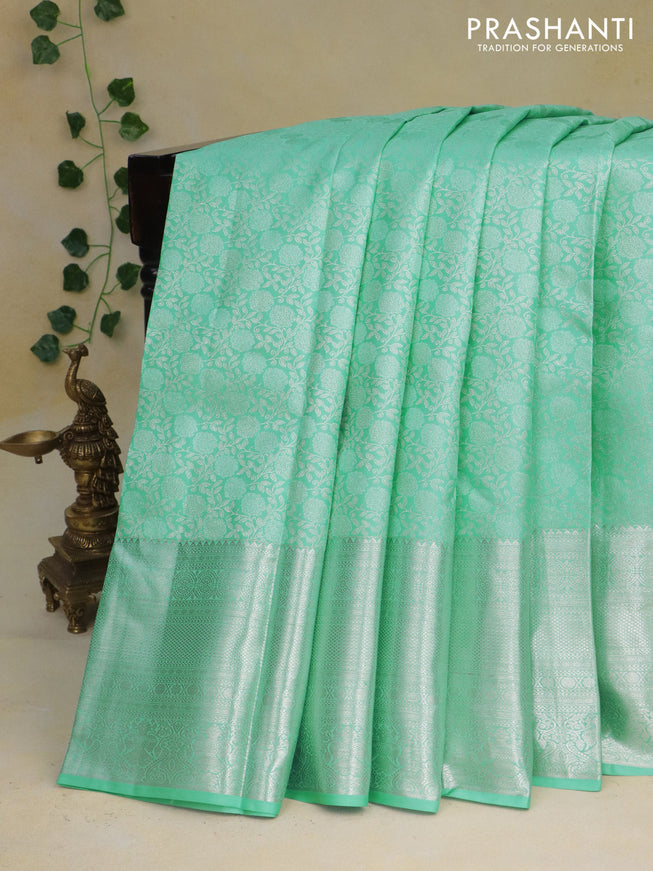 Pure kanchipuram silk saree teal blue and lotus pink with allover silver zari woven brocade weaves and silver zari woven border