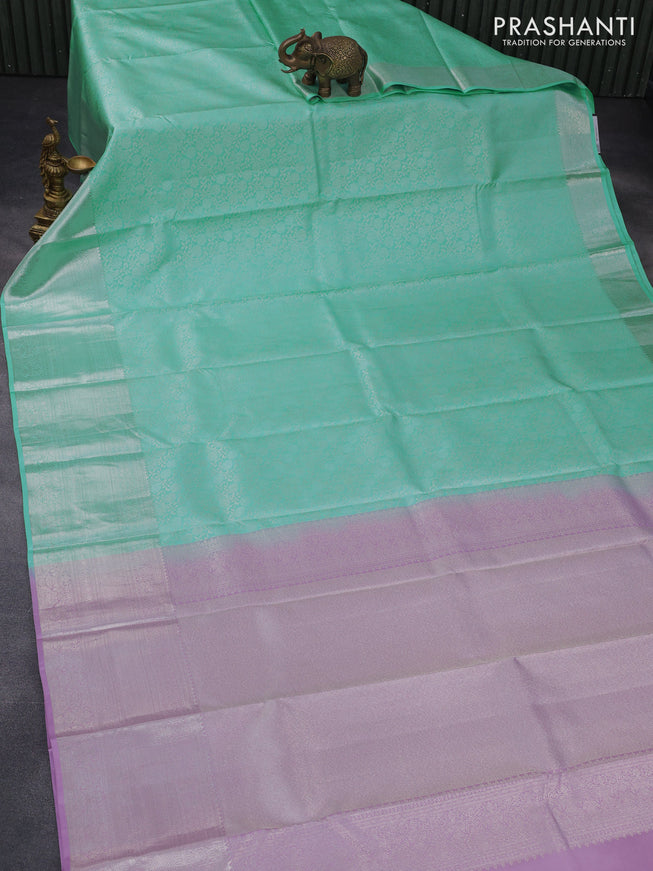 Pure kanchipuram silk saree teal blue and lotus pink with allover silver zari woven brocade weaves and silver zari woven border