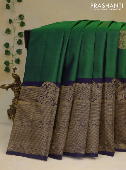 Pure kanchipuram silk saree green and dark blue with paisley zari woven buttas and rich zari woven border