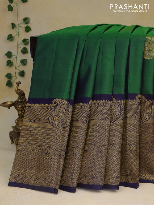 Pure kanchipuram silk saree green and dark blue with paisley zari woven buttas and rich zari woven border