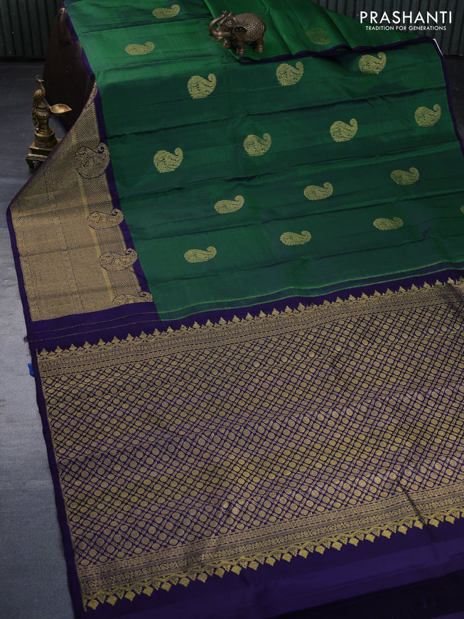 Pure kanchipuram silk saree green and dark blue with paisley zari woven buttas and rich zari woven border