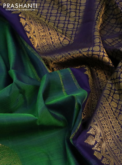 Pure kanchipuram silk saree green and dark blue with paisley zari woven buttas and rich zari woven border