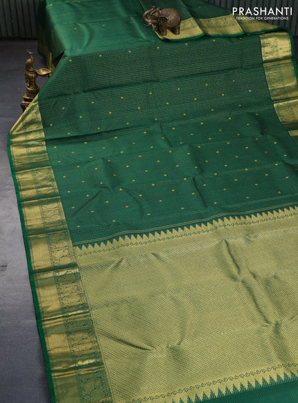 Pure kanchipuram silk saree green with allover small zari checks & buttas and annam zari woven border