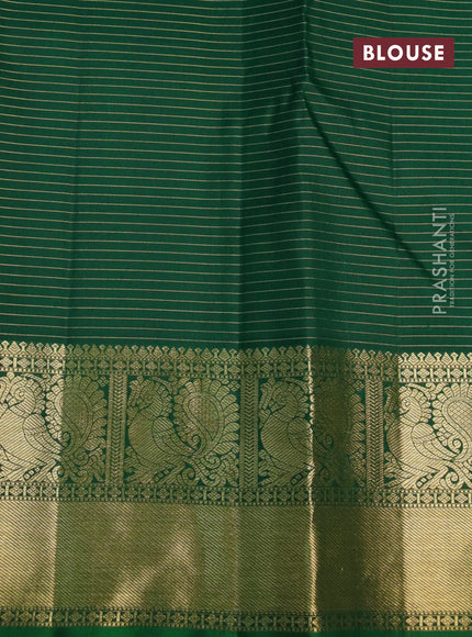 Pure kanchipuram silk saree green with allover small zari checks & buttas and annam zari woven border