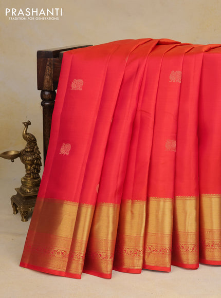 Pure kanchipuram silk saree dual shade of pinkish orange and teal blue with annam zari woven buttas and zari woven border