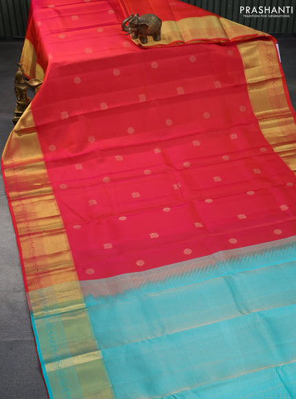 Pure kanchipuram silk saree dual shade of pinkish orange and teal blue with annam zari woven buttas and zari woven border