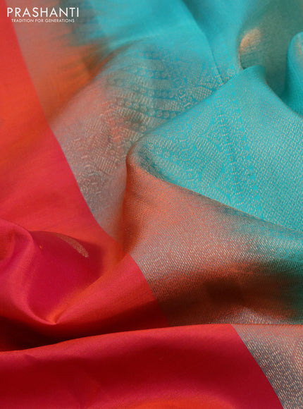 Pure kanchipuram silk saree dual shade of pinkish orange and teal blue with annam zari woven buttas and zari woven border