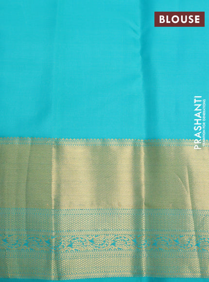 Pure kanchipuram silk saree dual shade of pinkish orange and teal blue with annam zari woven buttas and zari woven border