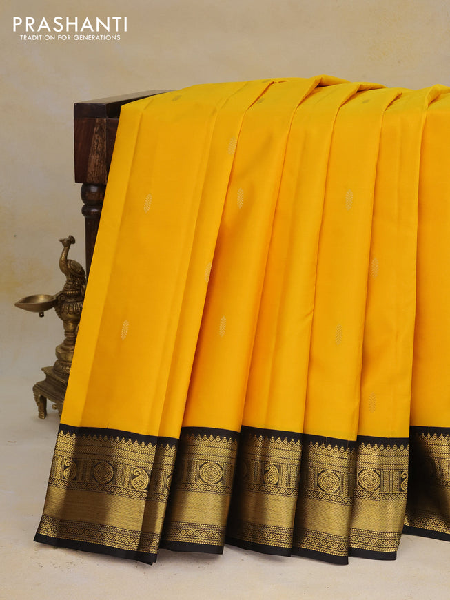 Pure kanchipuram silk saree yellow and black with zari woven buttas and zari woven korvai border