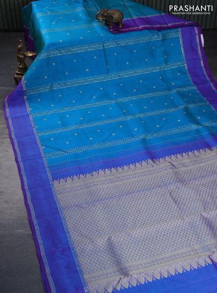 Pure kanchipuram silk saree dual shade of teal blue and dual shade of purple with zari woven buttas and rettapet zari woven border