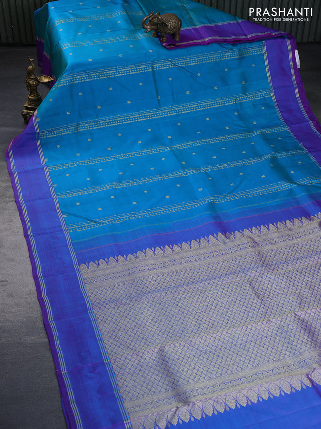 Pure kanchipuram silk saree dual shade of teal blue and dual shade of purple with zari woven buttas and rettapet zari woven border