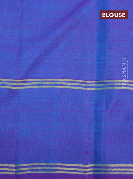 Pure kanchipuram silk saree dual shade of teal blue and dual shade of purple with zari woven buttas and rettapet zari woven border