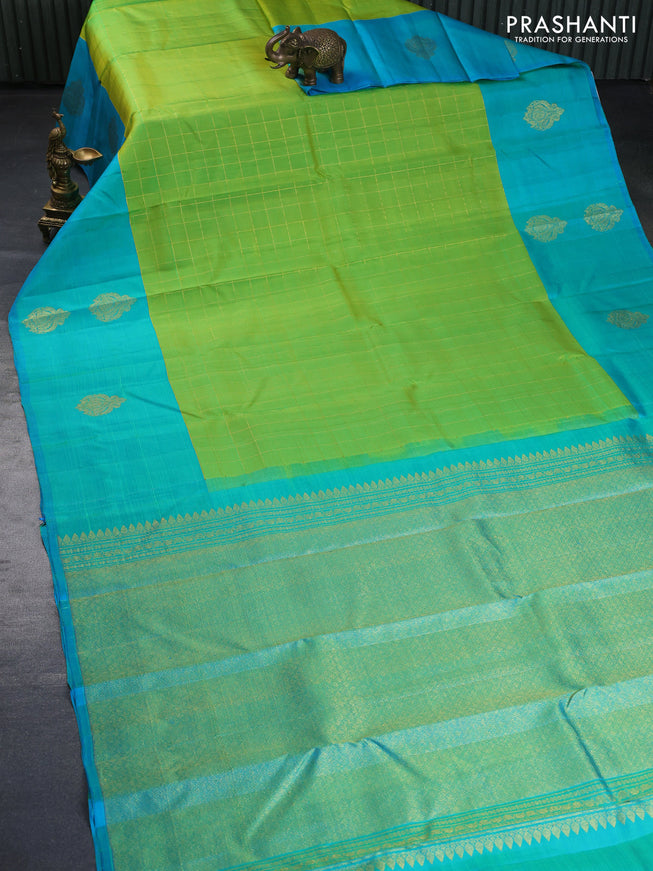 Pure kanchipuram silk saree light green and teal blue with allover zari checked pattern and zari woven butta border