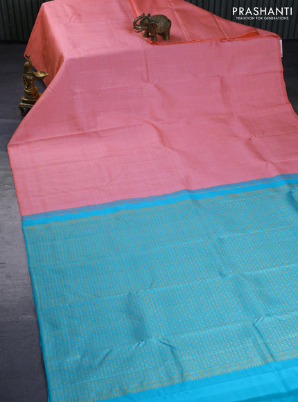 Pure kanchipuram silk saree peach pink and teal blue with allover zari weaves & buttas in borderless style