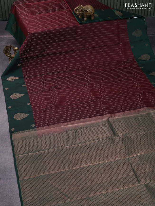 Pure kanchipuram silk saree deep maroon and bottle green with allover copper zari weaves and zari woven butta border