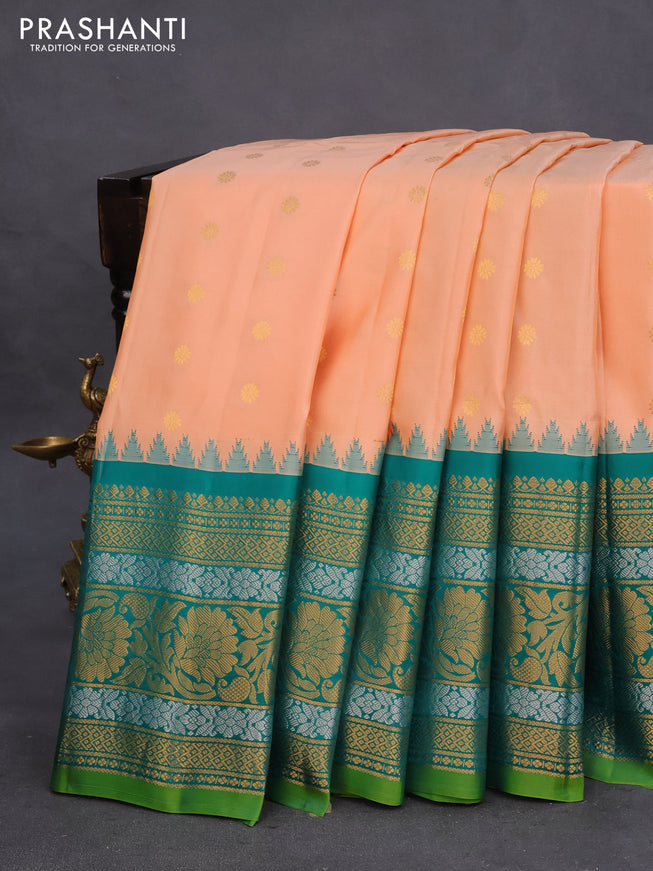 Pure gadwal silk saree pale orange and green with floral zari woven buttas and temple deisgn long zari woven border