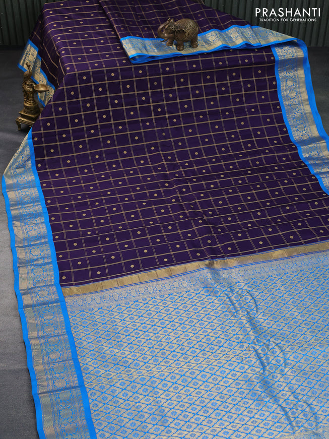 Pure gadwal silk saree dark blue and cs blue with allover zari checks & buttas and zari woven border