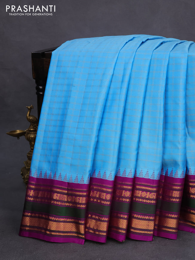 Pure gadwal silk saree light blue and purple with allover zari checks & buttas and temple design zari woven border