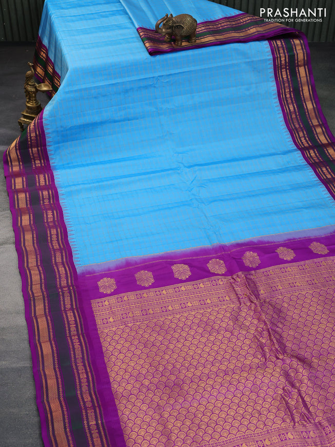 Pure gadwal silk saree light blue and purple with allover zari checks & buttas and temple design zari woven border