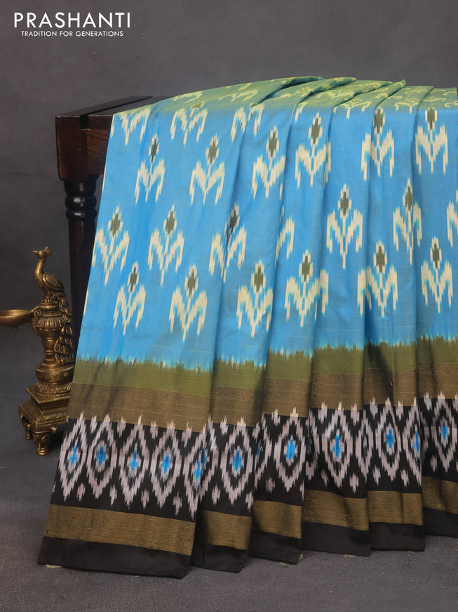 Pochampally silk saree light blue and black with allover ikat butta weaves and rettapet zari woven ikat style border