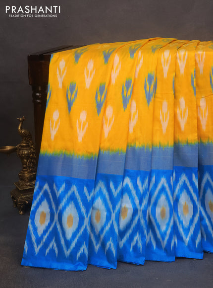 Pochampally silk saree mango yellow and light blue with allover ikat butta weaves and zari woven ikat style border